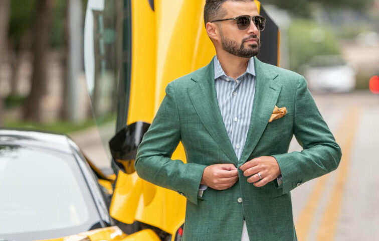 Stylish man in front of sportscar wearing clothes from Zspoke