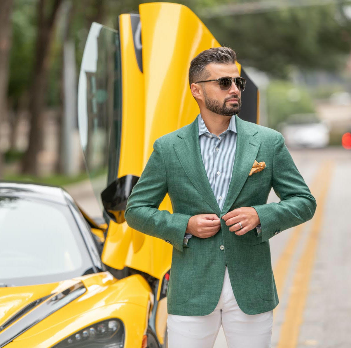 Stylish man in front of sportscar wearing clothes from Zspoke