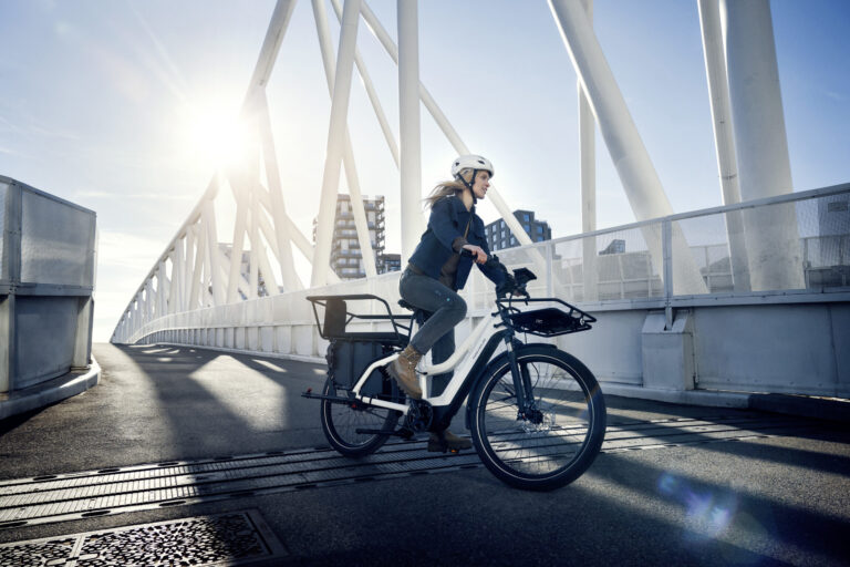 Woman on electric bike from Electric Avenue
